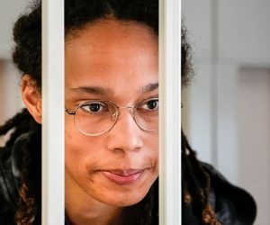 WNBA star and two-time Olympic gold medalist Brittney Griner speaks to her lawyers standing in a cage at a court room prior to a hearing, in Khimki just outside Moscow, Russia, July 26, 2022. Alexander Zemlianichenko/Pool via REUTERS
