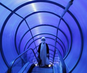epaselect epa10137520 An Iranian cleric takes pedestrian bridge elevator in a street in Tehran, Iran, 25 August 2022. According to Iranian foreign ministry, Iran has received US answer to its nuclear deal on 24 August 2022. The ministry also reported that Tehran will respond to US and EU soon. Iran has responded on 16 August 2022 officially to top European Union proposal aimed at salvaging 2015 nuclear deal with world powers, and was waiting for US and EU response. Iran is facing economic crisis over sanctions by US and EU.  EPA/ABEDIN TAHERKENAREH