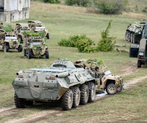epa10152528 Soldiers ride a BTR-80 amphibious armoured personnel carrier (F) and several Polaris MRZR ultra-light combat vehicles during a special exercise of the Hungarian military to increase reactive and combat capabilities at the army's Bakony Combat Training Centre near Ujdorogd, western Hungary, 01 September 2022. In early summer a higher degree of military alertness was ordered in Hungary to respond to increased security risks in connection with the protracted war in neighbouring Ukraine and the growing pressure of illegal migration at the country's southern borders.  EPA/Tamas Vasvari HUNGARY OUT