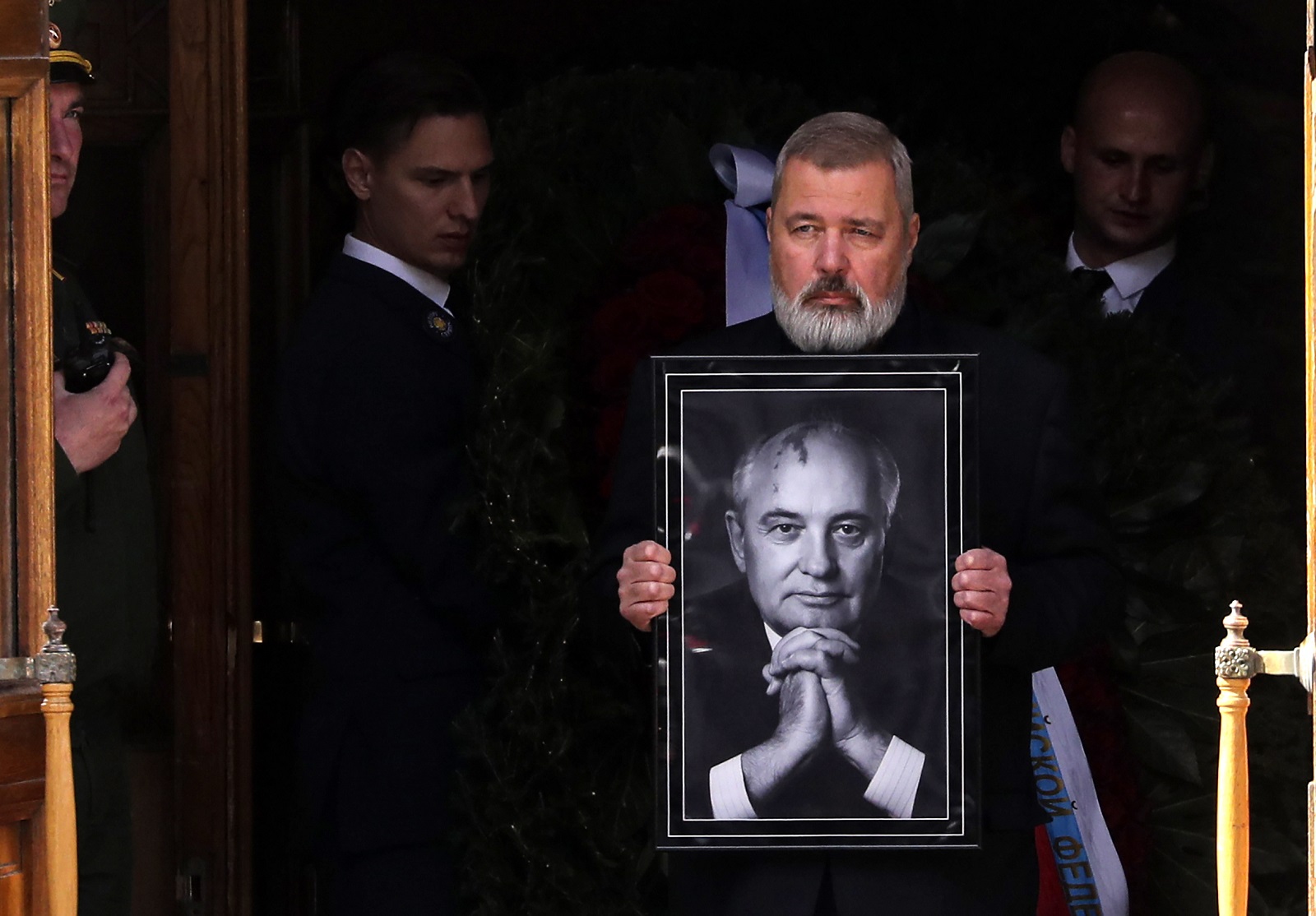 epa10156806 Nobel Peace Prize laureate journalist Dmitry Muratov carries a picture of late former Soviet president Mikhail Gorbachev after a farewell ceremony at the House of Trade Unions in Moscow, Russia, 03 September 2022. Former Soviet leader Mikhail Gorbachev died on 30 August 2022 at the age of 91 in Moscow Central Clinical Hospital. Gorbachev initiated numerous reforms during his tenure. He signed a nuclear arms treaty with the United States and withdrew the Soviet Union from the Soviet-Afghan war. His policies created freedom of speech and press, and decentralized fiscal policy planning and execution to increase efficiency. Gorbachev was the last leader of the Soviet Union, overseeing Russia transition from one party rule to a fragile democracy. Gorbachev will be buried at the Novodevichy Cemetery in Moscow next to the grave of his wife Raisa.  EPA/MAXIM SHIPENKOV