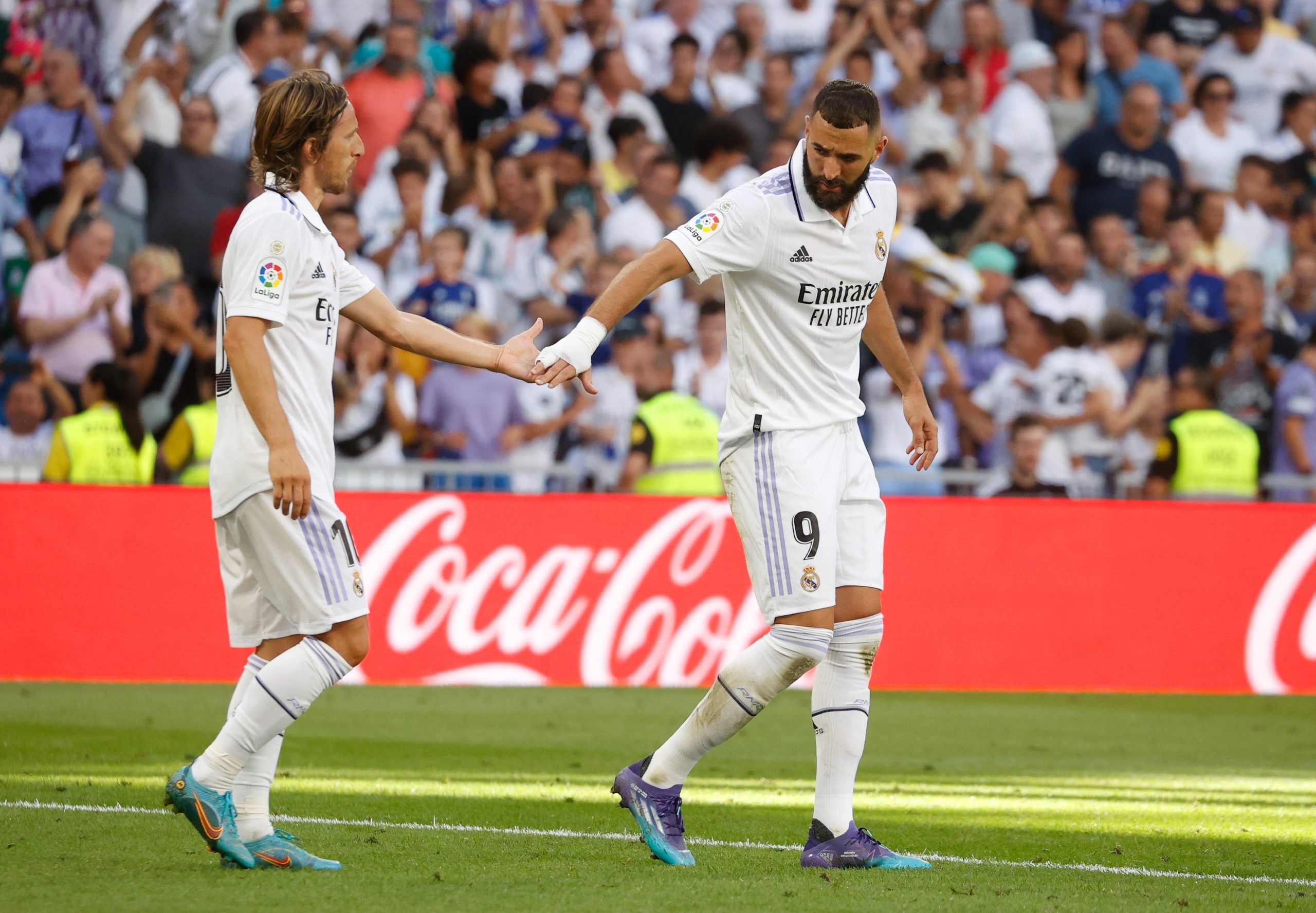 epa10157555 Real Madrid's Luka Modric (L) and Karim Benzema react during the Spanish LaLiga soccer match between Real Madrid and Real Betis at Santiago Bernabeu in Madrid, Spain, 03 September 2022.  EPA/JUAN CARLOS HIDALGO