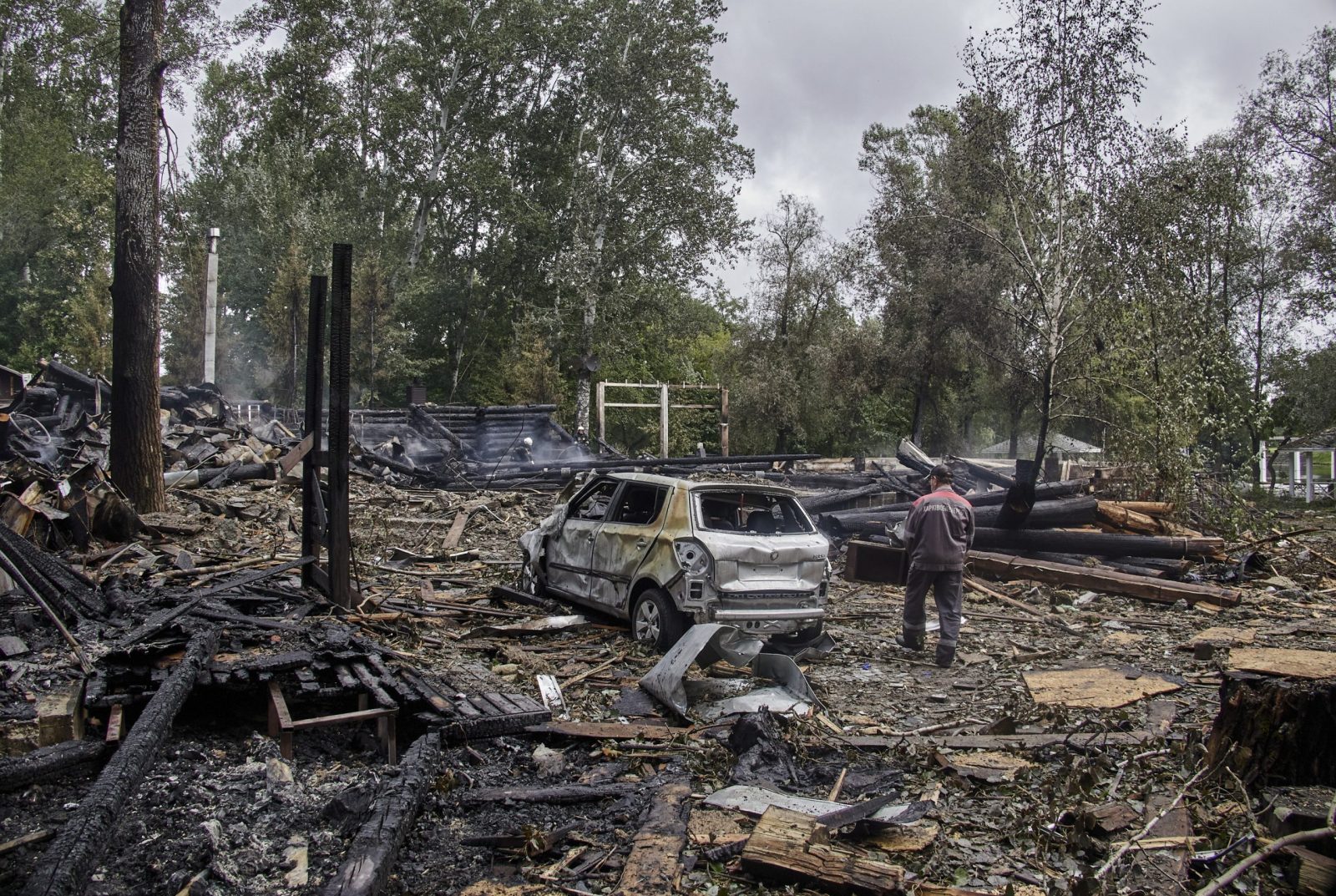 epa10158885 A communal worker inspects a site after a Russian rocket attack hit a restaurant complex in Kharkiv, Ukraine, 04 September 2022. Two main buildings and a summer pavilion on a total area of ??2,200 square meters were burned, according to the State Emergency Services. Kharkiv and surrounding areas have been the target of heavy shelling since February 2022, when Russian troops entered Ukraine starting a conflict that has provoked destruction and a humanitarian crisis.  EPA/SERGEY KOZLOV