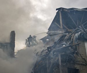 epa10164406 Ukrainian rescuers work on the site after airstrikes destroyed a residential building in Kharkiv, Ukraine, 06 September 2022. Kharkiv and surrounding areas have been the target of heavy shelling since February 2022, when Russian troops entered Ukraine starting a conflict that has provoked destruction and a humanitarian crisis.  EPA/SERGEY KOZLOV