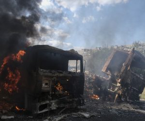 epa10171003 Burnt trucks after shelling in the small city of Bakhmut near the frontline in the Donetsk area, Ukraine, 08 September 2022 amid the Russian invasion. Russian troops entered Ukraine on 24 February 2022 starting a conflict that has provoked destruction and a humanitarian crisis.  EPA/SERGEY SHESTAK