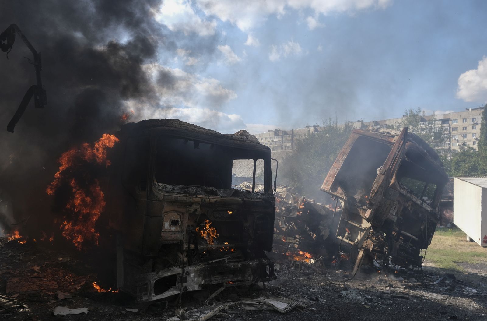 epa10171003 Burnt trucks after shelling in the small city of Bakhmut near the frontline in the Donetsk area, Ukraine, 08 September 2022 amid the Russian invasion. Russian troops entered Ukraine on 24 February 2022 starting a conflict that has provoked destruction and a humanitarian crisis.  EPA/SERGEY SHESTAK