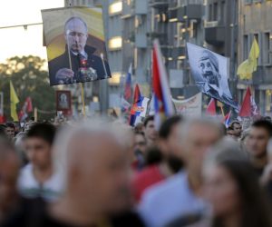 epa10178605 Protestors march holding flags of controversial Serb World War II leader General Dragoljub Draza Mihailovic (R) and Russian President Vladimir Putin (L) during a protest against the international LGBTQ event EuroPride in Belgrade, Serbia, 11 September 2022. EuroPride, a pan-European international event dedicated to LGBTQ pride, is hosted by a different European city each year. Serbia's capital Belgrade is supposed to host the event on the 17 September 2022, but according to country leaders, citing threats from right-wing extremist groups and fears of clashes the final decision on whether the event will be held has not been confirmed.  EPA/ANDREJ CUKIC