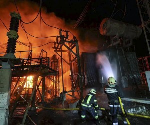 epa10178852 Ukrainian rescuers extinguish a fire after a rocket hit an infrastructure object in  Kharkiv, Ukraine, 11 September 2022 amid Russia's military invasion. Energy and water supply disappeared on Sunday evening in many districts of Kharkiv after Russian rockets hit an infrastructure facility, Mayor Ihor Terekhov said. Kharkiv and surrounding areas have been the target of heavy shelling since February 2022, when Russian troops entered Ukraine starting a conflict that has provoked destruction and a humanitarian crisis.  EPA/SERGEY KOZLOV