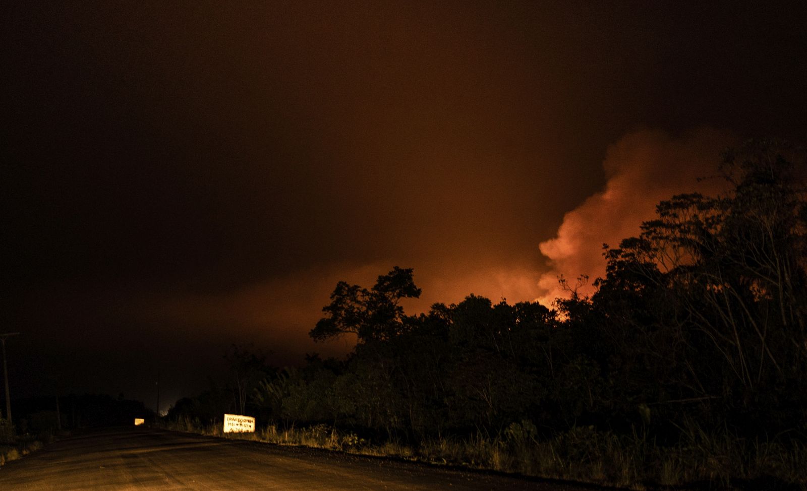 epa10180076 View of the construction on the BR-319 highway, It is the only highway that connects the city of Mannose with the south of Brazil, 06 September 2022 (issued 12 September 2022). Deforestation and fires coexist, side by side, with the asphalting works of BR-319, the controversial Brazilian highway that is leaving a trail of devastation as it passes through the Amazon.  EPA/Raphael Alves
