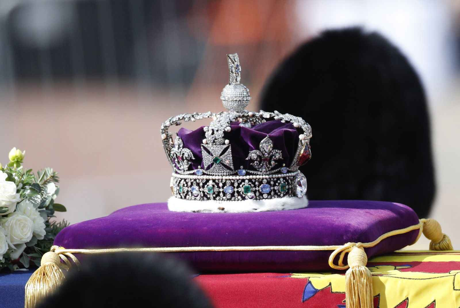 epa10183597 The Imperial State Crown lays on top of the coffin containing the body of Britain's late Queen Elizabeth II, draped in the royal standard, as it is transported on a gun carriage of the King's Troop Royal Horse Artillery from Buckingham Palace to Westminster Hall followed by members of the royal family in London, Britain, 14 September 2022. After a short service, the queen's lying in state will begin, lasting for four days and ending on the morning of the state funeral on the 19 September.  EPA/YOAN VALAT
