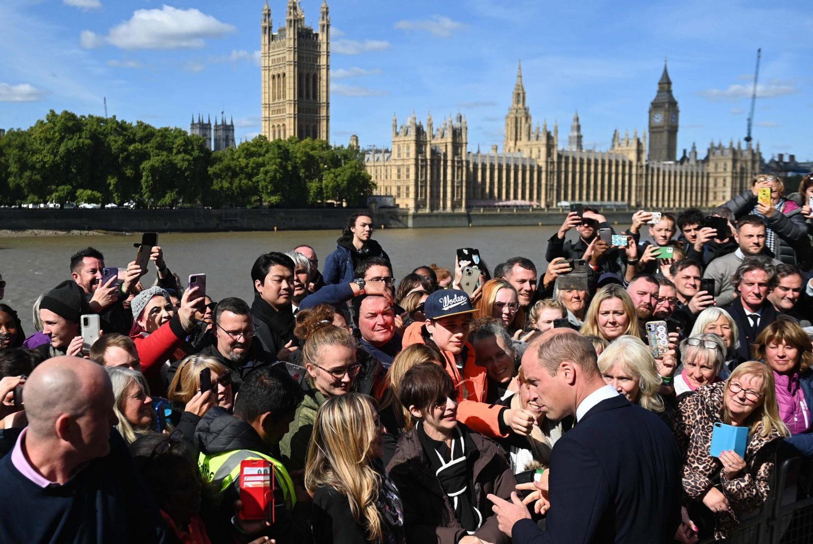 epa10189695 Britain's William, Prince of Wales (R) greets people in the queue to see Britain's late Queen Elizabeth II lying in state on the South Bank in London, Britain, 17 September 2022.  The queen's funeral will be held on 19 September, following four days of lying in state inside Westminster Hall.  EPA/NEIL HALL