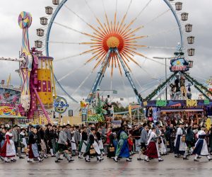 epa10191403 People in traditional clothing participate in the costume parade during the 187th edition of the traditional Oktoberfest beer and amusement festival in the German Bavaria state's capital of Munich, Germany, 18 September 2022. The Oktoberfest 2022 runs from 17 September to 03 October 2022 and several millions of visitors are expected from all over the world. The event resumes after being canceled for two years in a row due to the coronavirus disease (COVID-19) pandemic.  EPA/CHRISTIAN BRUNA