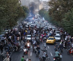 epa10197708 People clash with police during a protest  following the death of Mahsa Amini, in Tehran, Iran, 21 September 2022. Mahsa Amini, a 22-year-old Iranian woman, was arrested in Tehran on 13 September by the morality police, a unit responsible for enforcing Iran's strict dress code for women. She fell into a coma while in police custody and was declared dead on 16 September, with the authorities saying she died of a heart failure while her family advising that she had no prior health conditions. Her death has triggered protests in various areas in Iran and around the world. According to Iran's state news agency IRNA, Iranian President Ebrahim Raisi expressed his sympathy to the family of Amini on a phone call and assured them that her death will be investigated carefully. Chief Justice of Iran Gholam-Hossein Mohseni-Eje'i assured her family that upon its conclusion, the investigation results by the Iranian Legal Medicine Organization will be announced without any special considerations.  EPA/STR