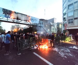 epa10197705 People clash with police during a protest  following the death of Mahsa Amini, in Tehran, Iran, 21 September 2022. Mahsa Amini, a 22-year-old Iranian woman, was arrested in Tehran on 13 September by the morality police, a unit responsible for enforcing Iran's strict dress code for women. She fell into a coma while in police custody and was declared dead on 16 September, with the authorities saying she died of a heart failure while her family advising that she had no prior health conditions. Her death has triggered protests in various areas in Iran and around the world. According to Iran's state news agency IRNA, Iranian President Ebrahim Raisi expressed his sympathy to the family of Amini on a phone call and assured them that her death will be investigated carefully. Chief Justice of Iran Gholam-Hossein Mohseni-Eje'i assured her family that upon its conclusion, the investigation results by the Iranian Legal Medicine Organization will be announced without any special considerations.  EPA/STR