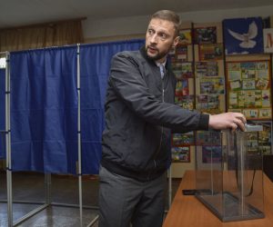 epa10199298 Chairman of the Central Election Commission of the self-proclaimed Donetsk People's Republic Vladimir Vysotsky examines a ballot box at a poling station during preparations for a referendum to join the Russian Federation in Donetsk, Ukraine, 22 September 2022. The parliaments of the self-proclaimed Luhansk and Donetsk Peoples Republics as well as the military-civilian administrations controlled by Russia of the Kherson and Zaporizhzhia regions decided to hold referendums on the future of these territories. On 24 February 2022 Russian troops entered the Ukrainian territory in what the Russian president declared a 'Special Military Operation', starting an armed conflict that has provoked destruction and a humanitarian crisis.  EPA/ALESSANDRO GUERRA