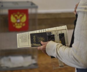 epa10201150 Refugees from Ukraine cast their ballots in a referendum at a polling station in Sevastopol, Crimea, 23 September 2022. From September 23 to 27, residents of the Donetsk People's Republic, Luhansk People's Republic, Kherson and Zaporizhzhia regions will vote in a referendum on joining the Russian Federation. Russian President Vladimir Putin said that the Russian Federation will ensure security at referendums in the DPR, LPR, Zaporizhzhia and Kherson regions and support their results.  EPA/STRINGER