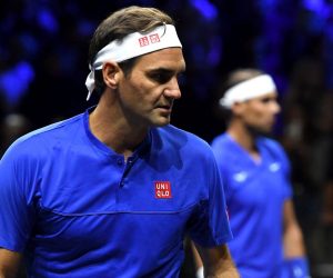 epa10202591 Team Europe double Roger Federer (foreground) of Switzerland and Rafael Nadal of Spain in their match against Team World double Jack Sock of the US and Frances Tiafoe of the US on the first day of the Laver Cup tennis tournament in London, Britain, 23 September 2022.  EPA/ANDY RAIN