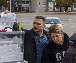 epa10203895 People take part in a referendum, at an outdoor polling station in Luhansk, eastern Ukraine, 24 September 2022. From 23 to 27 September, residents of the self-proclaimed Luhansk and Donetsk People's Republics as well as the Russian-controlled areas of the Kherson and Zaporizhzhia regions of Ukraine vote in a referendum to join the Russian Federation. On 24 February 2022 Russian troops entered the Ukrainian territory in what the Russian president declared a 'Special Military Operation', starting an armed conflict that has provoked destruction and a humanitarian crisis.   EPA/STRINGER