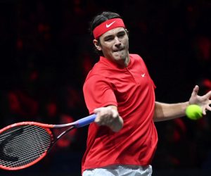 epa10203804 Taylor Fritz of Team World in action against Cameron Norrie of Team Europe during a Laver Cup tennis match at the O2 Arena in London, Britain, 24 September 2022.  EPA/ANDY RAIN