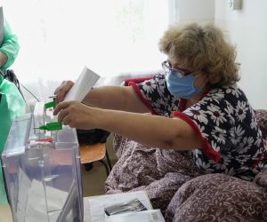 epa10207655 A woman casts her ballot during voting in a so-called referendum on the joining of Russian-controlled regions of Ukraine to Russia, in a hospital in Berdyansk, Zaporizhzhia region, Ukraine, 25 September 2022. From 23 to 27 September, residents of the self-proclaimed Luhansk and Donetsk People's Republics as well as the Russian-controlled areas of the Kherson and Zaporizhzhia regions of Ukraine are voting in ''referendums'' to join the Russian Federation that Ukraine call a farce. On 24 February 2022 Russian troops entered the Ukrainian territory in what the Russian president declared a 'Special Military Operation', starting an armed conflict that has provoked destruction and a humanitarian crisis.  EPA/STRINGER