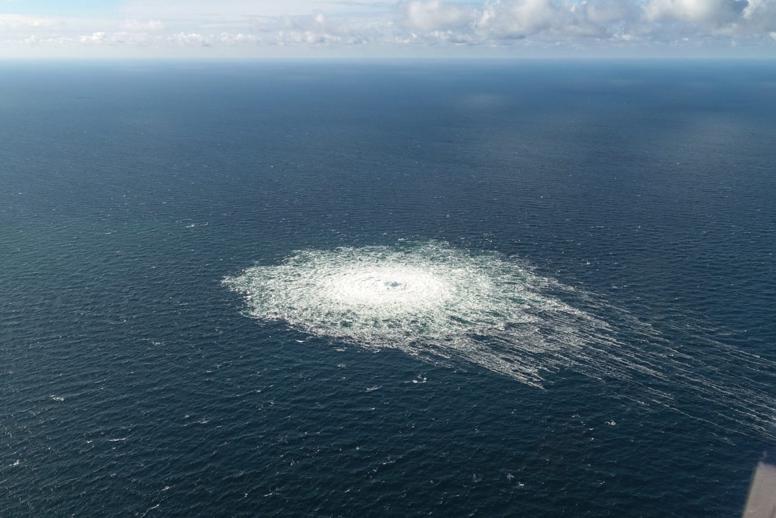 epa10209592 A handout photo taken from a Danish F-16 jet on 27 September 2022 and made available by the Danish Defence Command shows a gas leak of the Nord Stream 2 pipeline off Bornholm, Denmark, Baltic Sea. The Danish energy agency confirmed 27 September 2022 three gas leaks on the Nord Stream 1 and 2 pipelines.  EPA/Danish Defence Command / HANDOUT  HANDOUT EDITORIAL USE ONLY/NO SALES