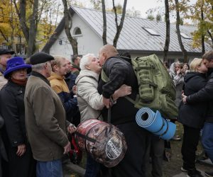 epa10213464 Russian conscripted men say goodbye to relatives at a recruiting office during Russia's partial military mobilization in Moscow, Russia, 29 September 2022. Russian President Putin announced in a televised address to the nation on 21 September, that he signed a decree on partial mobilization in the Russian Federation due to the conflict in Ukraine. Russian Defense Minister Shoigu said that 300,000 people would be called up for service as part of the move.  EPA/YURI KOCHETKOV