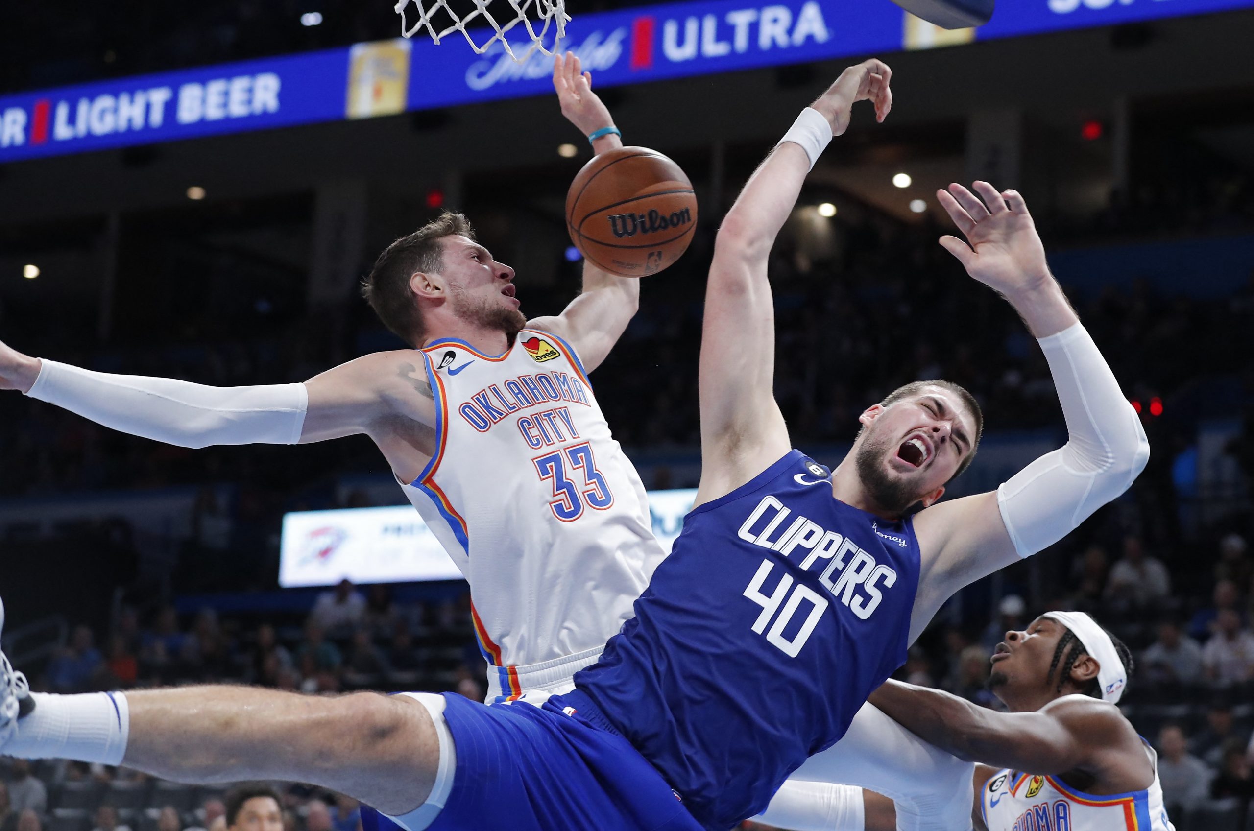 Oct 25, 2022; Oklahoma City, Oklahoma, USA; Oklahoma City Thunder center Mike Muscala (33) and LA Clippers center Ivica Zubac (40) collide on a play during the second half at Paycom Center. Oklahoma City won 108-94. Mandatory Credit: Alonzo Adams-USA TODAY Sports