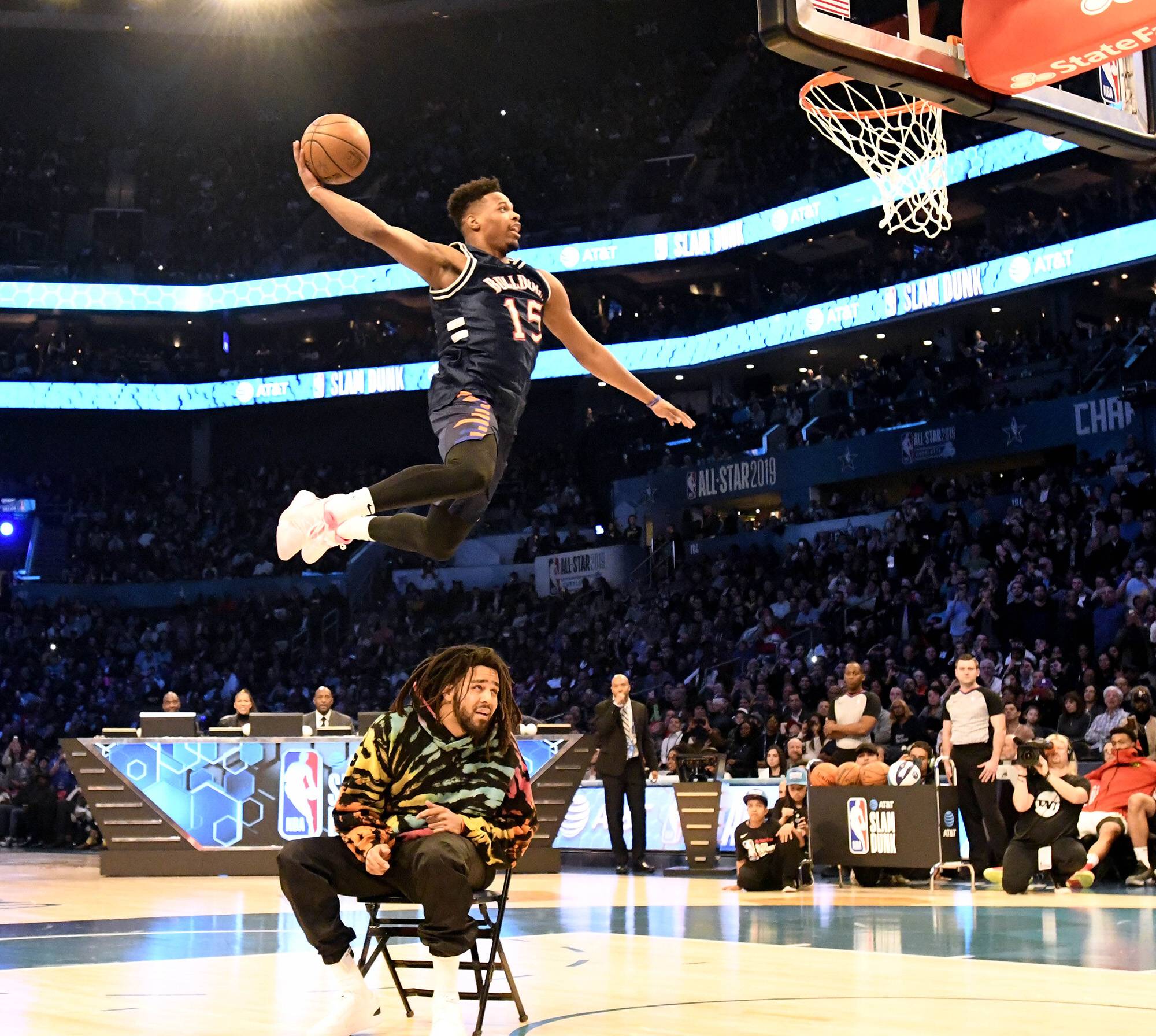February 16, 2019 - Charlotte, NC, USA - The New York Knicks Dennis Smith Jr., dunks over entertainer J. Cole, after Cole threw the ball up in the air, during the AT&T Slam Dunk Contest at Spectrum Center in Charlotte, N.C., on Saturday, Feb. 16, 2019. AT&T Slam Dunk Contest  - ZUMAm67_ 20190216_zaf_m67_078 Copyright: xDavidxT.xFosterxIiix
