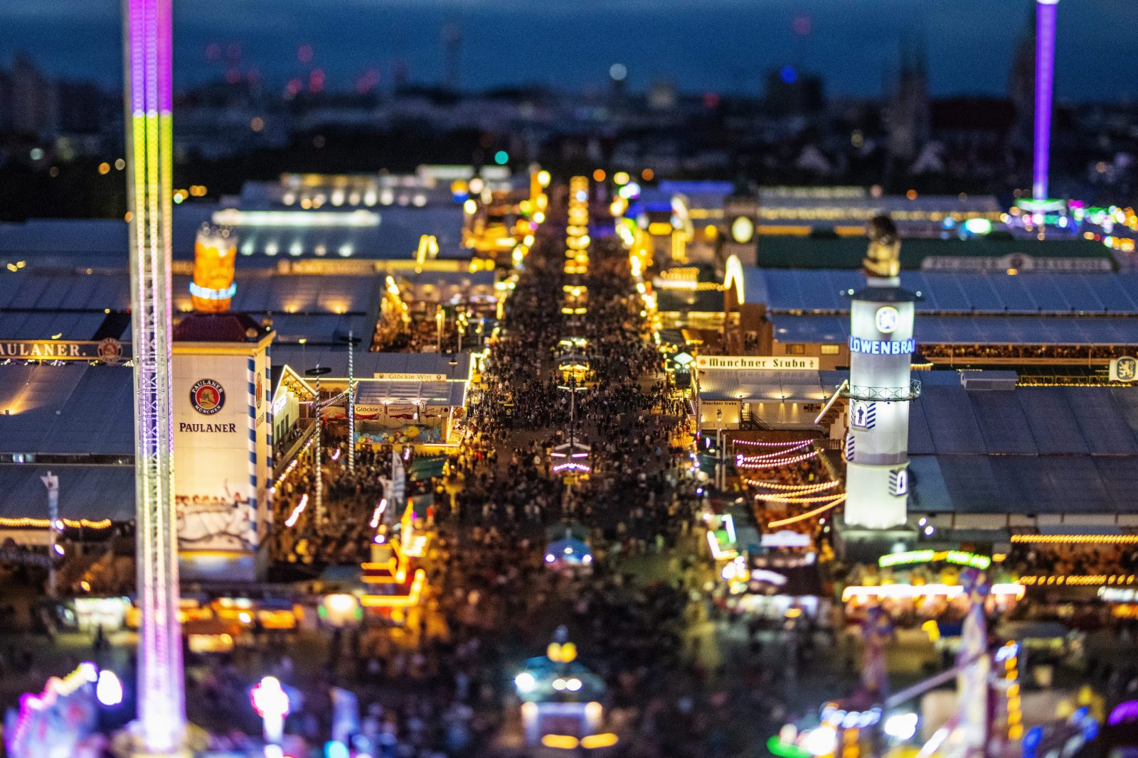 epa10190450 A picture taken with a tilt-shift lens shows a general view on beer tents and crowds during the 187th edition of the traditional Oktoberfest beer and amusement festival in the German Bavaria state's capital Munich, Germany, 17 September 2022. The Oktoberfest 2022 runs from 17 September to 03 October 2022 and several millions of visitors are expected from all over the world. The event resumes after being canceled for two years in a row due to the coronavirus disease (COVID-19) pandemic.  EPA/CHRISTIAN BRUNA