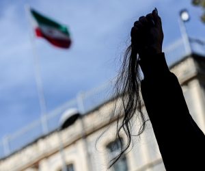 epa10207292 An Iranian woman holds piece of her hair she cuts off, during a protest outside the Iranian Consulate following the death of Mahsa Amini, in Istanbul, Turkey, 26 September 2022. Protests have erupted in Iran and across the world after the death of Mahsa Amini who died last week in custody of Iran's morality police.  EPA/SEDAT SUNA