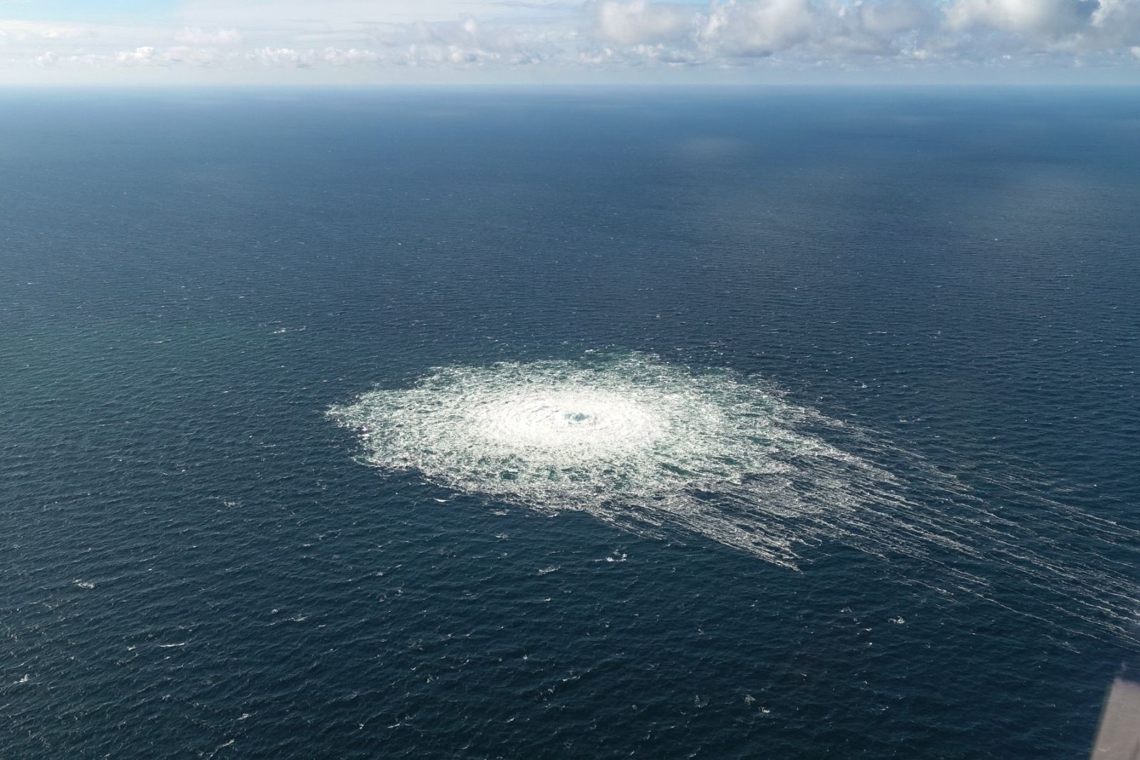 epa10209592 A handout photo taken from a Danish F-16 jet on 27 September 2022 and made available by the Danish Defence Command shows a gas leak of the Nord Stream 2 pipeline off Bornholm, Denmark, Baltic Sea. The Danish energy agency confirmed 27 September 2022 three gas leaks on the Nord Stream 1 and 2 pipelines.  EPA/Danish Defence Command / HANDOUT  HANDOUT EDITORIAL USE ONLY/NO SALES