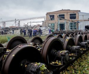 epa10211700 Railway workers check the area of a destroyed railway infrastructure and train carriages after recent shelling in Kharkiv, northeastern Ukraine, 28 September 2022. Kharkiv and surrounding areas have been the target of heavy shelling since February 2022, when Russian troops entered Ukraine starting a conflict that has provoked destruction and a humanitarian crisis.  EPA/SERGEY KOZLOV