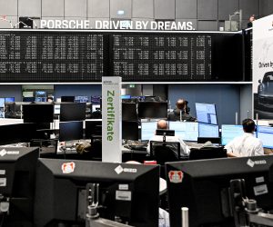 epa10213204 A trader watch monitors during the initial public offering (IPO) of German car manufacturer Porsche at the Frankfurt Stock Exchange in Frankfurt am Main, Germany, 29 September 2022. With the largest IPO in Germany in 25 years, German automaker Volkswagen has set the placement price for the preferred shares at 82.50 euro in consultation with Porsche AG and the advising banks. This gives Porsche a stock market value of 75 billion euros. Porsche shares will be traded on the Frankfurt Stock Exchange for the first time on 29 September 2022.  EPA/SASCHA STEINBACH