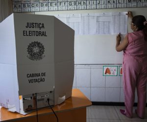 epa10217903 An electoral inspector prepares a polling station, in Brasilia, Brazil, 01 October 2022. Brazil is preparing for a decisive election day on Sunday 02 October, when 156,454,011 voters will be able to go to the polls to elect the new political representatives. This year the positions of President of the Republic are in dispute, to whom President Jair Bolsonaro aspires to re-election, as well as governors, senators and federal, state or district deputies.  EPA/JOEDSON ALVES