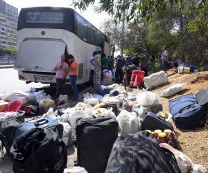 epa10219140 Syrian refugees gather as they prepare to leave Beirut, before their journey to their homes in Syria, in Beirut, Lebanon, 02 October 2022. Dozens of Syrian refugees leave Beirut and began their trip home.  EPA/WAEL HAMZEH