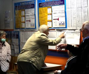 epa10219252 Bosnian voters read voting instructions and candidates lists for the vote country's general elections at a polling station in Sarajevo, Bosnia and Herzegovina, 02 October 2022. More than three million Bosnian citizens are expected to vote in the country's general elections in which 90 political parties and 10 candidates for the three Bosnian Presidency members were registered. The Bosnian Presidency according to the country's constitution always has to have three members, a Bosniak, a Serb, and a Croat, representing the three main ethnic groups  EPA/ALEKSANDAR GOLIC