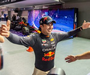 epa10219727 Mexican Formula One driver Sergio Perez of Red Bull Racing reacts after winning the Singapore Formula One Grand Prix race at the Marina Bay Street Circuit, Singapore, 02 October 2022.  EPA/TOM WHITE