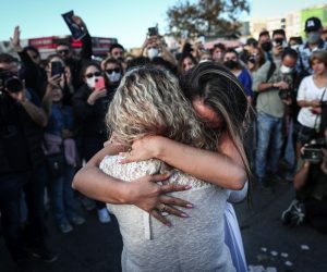 epa10219893 Iranian women hug during a protest following the death of Iranian Mahsa Amini, in Istanbul, Turkey, 02 October 2022. Amini, a 22-year-old Iranian woman, was arrested in Tehran on 13 September by the police unit responsible for enforcing Iran's strict dress code for women. She fell into a coma while in police custody and was declared dead on 16 September.  EPA/SEDAT SUNA