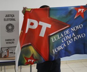 epa10220275 A supporter of the Workers Party arrives to vote in Sao Paulo, Brazil, 02 October 2022. Brazilians vote in election that will decide the next President between incumbent President Jair Bolsonaro and his leftist political nemesis, former President Luiz Inacio Lula da Silva in addition to electing 27 governors, 27 senators, 513 federal deputies, 1,035 state deputies and 24 district deputies.  EPA/Fernando Bizerra