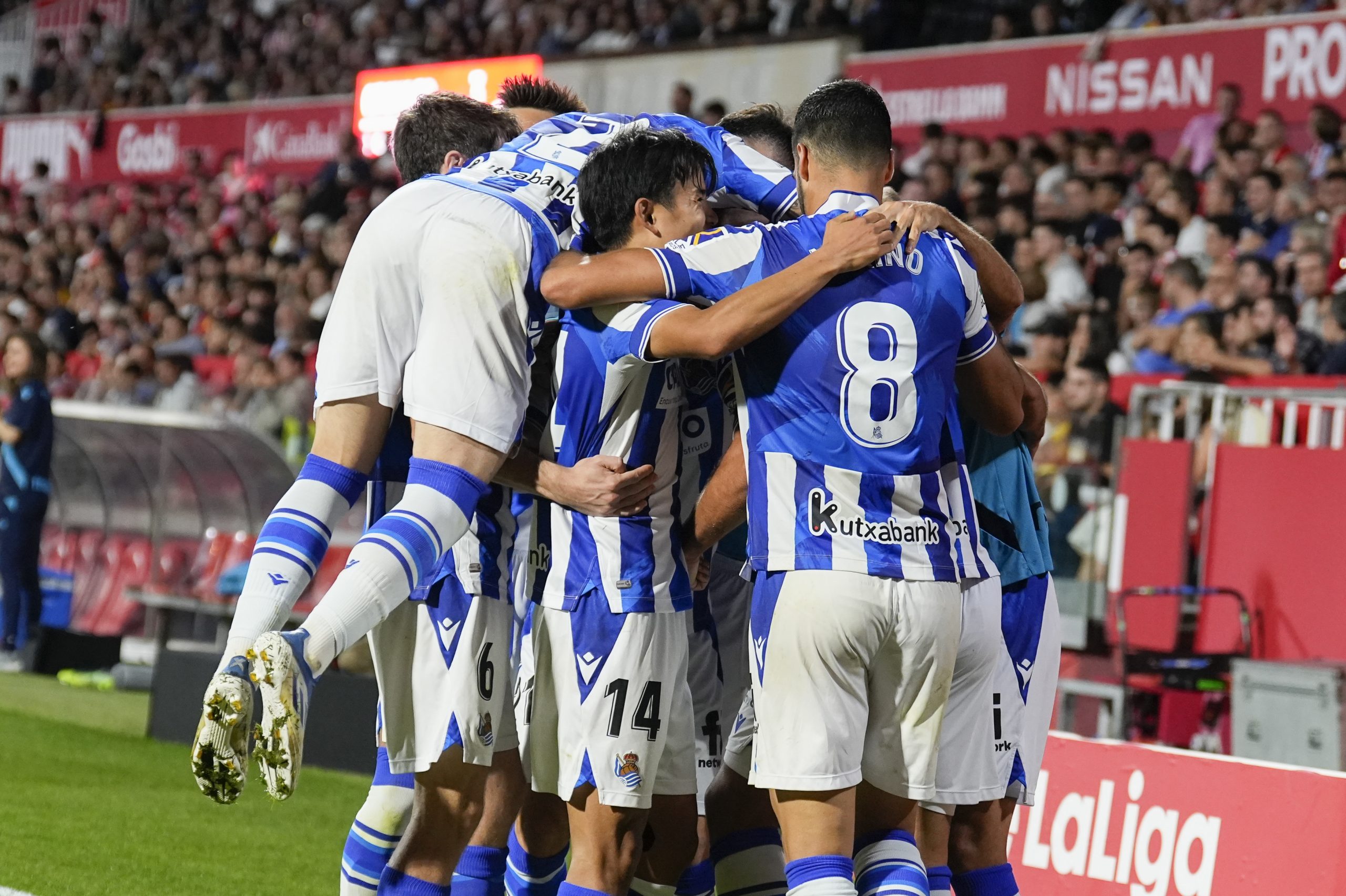 epa10220235 Real Sociedad's Takefusa Kubo (2-L) celebrates with teammates after scoring during the Spanish LaLiga soccer match between Girona and Real Sociedad at Montilivi stadium in Girona, Catalonia, north eastern Spain, 02 October 2022.  EPA/David Borrat