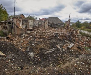 epa10221699 A shelling hole near a destroyed private building in the Ruska Lozova village in Kharkiv's area, Ukraine, 03 October 2022, amid Russia's military invasion. The Ukrainian army pushed Russian troops from occupied territory in the northeast of the country in a counterattack. Kharkiv and surrounding areas have been the target of heavy shelling since February 2022, when Russian troops entered Ukraine starting a conflict that has provoked destruction and a humanitarian crisis.  EPA/SERGEY KOZLOV