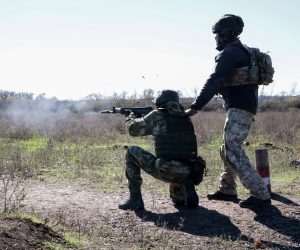 epa10224891 A Russian conscript with an instructor attends a shooting training at a military shooting range near Donetsk, Ukraine, 05 October 2022. Russian President Putin announced in a televised address to the nation on 21 September, that he signed a decree on partial mobilization in the Russian Federation. Russian Defense Minister Shoigu said that 300,000 people would be called up for service as part of the move. On 24 February 2022 Russian troops entered the Ukrainian territory in what the Russian president declared as a 'Special Military Operation', starting an armed conflict that has provoked destruction and a humanitarian crisis.  EPA/ALESSANDRO GUERRA