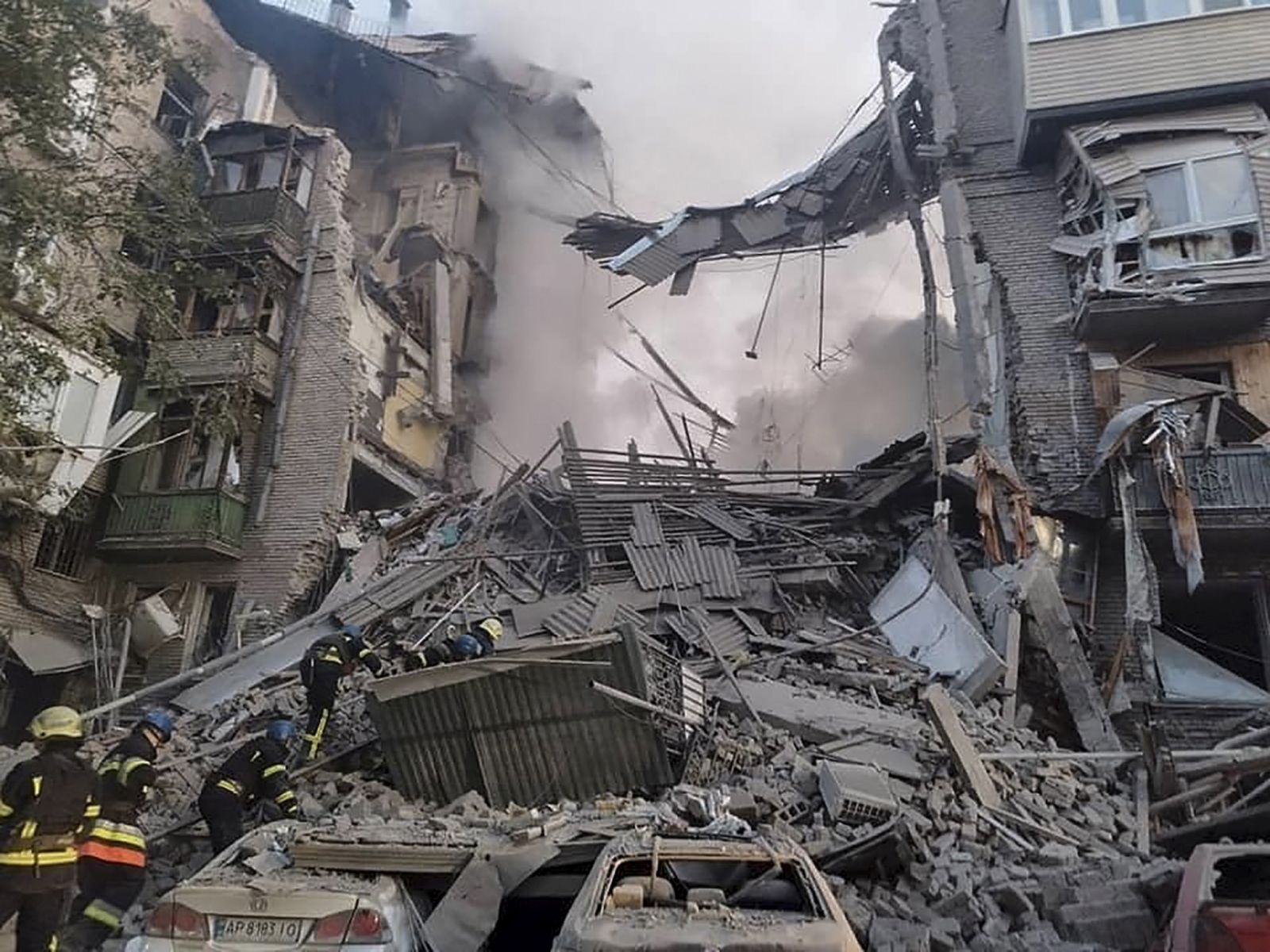 epa10226300 A handout photo released by the press service of the State Emergency Service of Ukraine shows Ukrainian rescuers working at the site of a damaged residential building after shelling in the city of Zaporizhzhia, southeastern Ukraine, 06 October 2022, amid Russia's military invasion. At least two people were killed and six others injured in missile strikes, the Deputy Head of the Presidential Office Kyrylo Tymoshenko said. Russian troops entered Ukraine on 24 February 2022 starting a conflict that has provoked destruction and a humanitarian crisis.  EPA/STATE EMERGENCY SERVICE OF UKRAI -- BEST QUALITY AVAILABLE -- MANDATORY CREDIT: STATE EMERGENCY SERVICE OF UKRAINE -- HANDOUT EDITORIAL USE ONLY/NO SALES