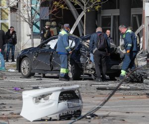 epa10234260 Ukrainian experts inspect a destroyed car after shelling in downtown Kyiv (Kiev), Ukraine, 10 October 2022. Explosions have been reported in several districts of the Ukrainian capital Kyiv on 10 October. At least nine people died and dozens injured as a result of the attacks, the State Emergency Service (SES) of Ukraine said. Russian troops entered Ukraine on 24 February 2022 starting a conflict that has provoked destruction and a humanitarian crisis.  EPA/SERGEY DOLZHENKO