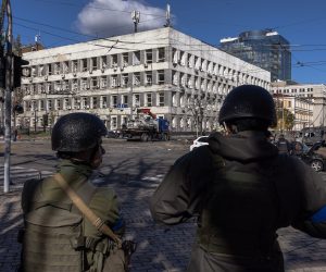 epa10234496 Members of the Ukrainian military stand guard next to a site hit by a missile strike in downtown Kyiv (Kiev), Ukraine, 10 October 2022. Explosions have been reported in several districts of the Ukrainian capital Kyiv on 10 October. At least 11 people died and dozens injured as a result of rocket attacks targeting cities across Ukraine, the State Emergency Service (SES) of Ukraine said. Russian troops entered Ukraine on 24 February 2022 starting a conflict that has provoked destruction and a humanitarian crisis.  EPA/ROMAN PILIPEY