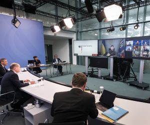 epa10236445 A handout photo made available by the German Governmet Press Office showing German Chancellor Olaf Scholz (2ndL) during a video meeting with Ukrainian President Volodymyr Zelenskyy (C on screen) as part of a G7 conference about Ukraine, in the Federal Chancellor's Office in Berlin, Germany 11 October 2022.  EPA/STEFFEN KUGLER HANDOUT  HANDOUT EDITORIAL USE ONLY/NO SALES