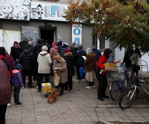 epa10237760 Ukrainian people receiving humanitarian aid, in Sviatohirsk village next to the city of Lyman, Donetsk area, Ukraine, 11 October 2022 (issued 12 October 2022). The Ukrainian army pushed Russian troops from occupied territory in the northeast of the country in a counterattack. Kharkiv and surrounding areas have been the target of heavy shelling since February 2022, when Russian troops entered Ukraine starting a conflict that has provoked destruction and a humanitarian crisis.  EPA/ATEF SAFADI
