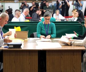 epa10240973 Vote counters recount ballots for the president of Republika Srpska, an entity of Bosnia and Herzegovina, at the Juan Antonio Samaranch Olympic Hall in Sarajevo, Bosnia and Herzegovina, 13 October 2022. The Coalition around Jelena Trivic, candidate for president of Republika Srpska, submitted a request to the Central Election Commission for a recount and annulment of the election for the president of the Republic of Srpska.  EPA/FEHIM DEMIR
