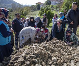 epa10245027 Elif Ayvaz (C), wife of coal mine blast victim Selcuk Ayvaz, reacts during his funeral ceremony in the town of Ugurlar near Bartin, Turkey, 15 October 2022. At least 40 people were killed and 11 others were injured in an explosion at a coal mine in Bartin, northern Turkey, on 14 October, the country's interior minister confirmed on 15 October 2022.  EPA/ERDEM SAHIN