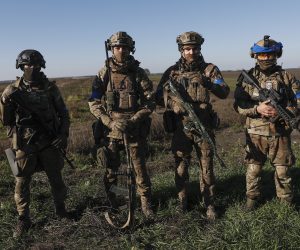 epaselect epa10245671 Ukrainian soldiers stand at a field on the outskirts of the recently recaptured city of Kupiansk, east of Kharkiv, northeastern Ukraine, 15 October 2022. The Ukrainian army pushed Russian troops from occupied territory in the northeast of the country in counterattacks. Kharkiv and surrounding areas have been the target of heavy shelling since February 2022, when Russian troops entered Ukraine starting a conflict that has provoked destruction and a humanitarian crisis.  EPA/ATEF SAFADI