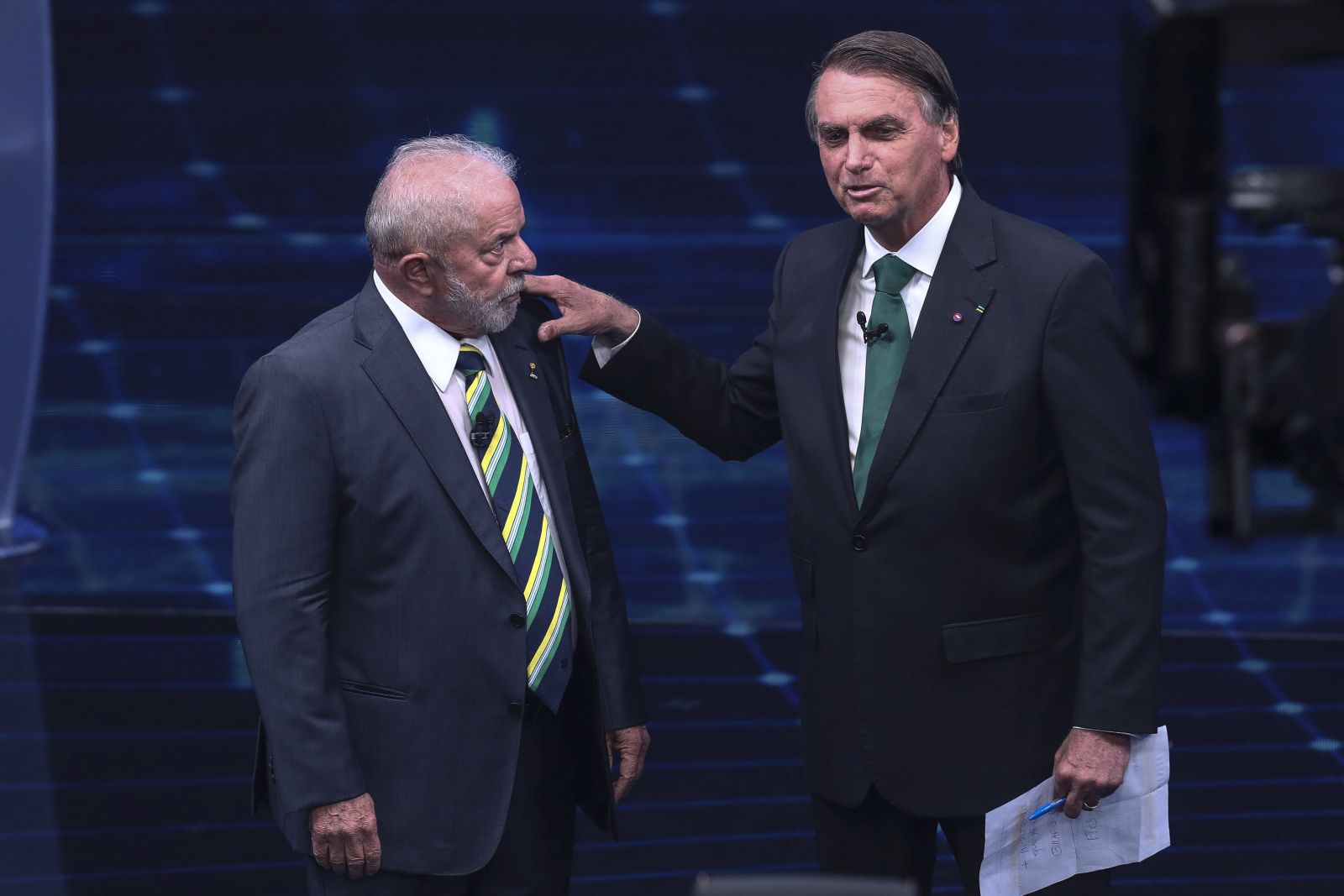 epa10248213 Brazil’s presidential candidates Luiz Inacio Lula da Silva (L) and Jair Bolsonaro (R) participate  in the first presidential debate ahead of the second round of the presidential elections in Brazil, at the Bandeirantes television headquarters, in Sao Paulo, Brazil, 16 October 2022.  EPA/Sebastiao Moreira